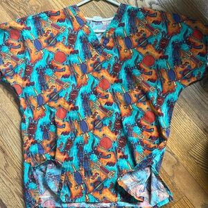 Turquoise/orange Vneck 2 pocket scrub top . Aztec/southwest pattern szS